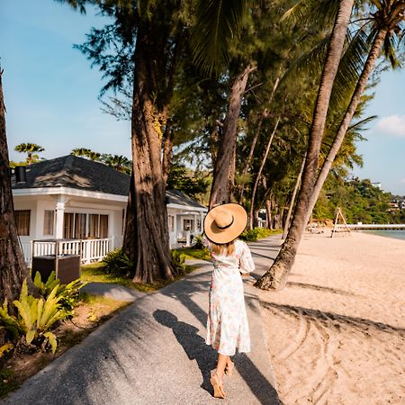 Thavorn Beach Village Resort & Spa Phuket Kamala Beach Exterior foto A woman walking on the beach